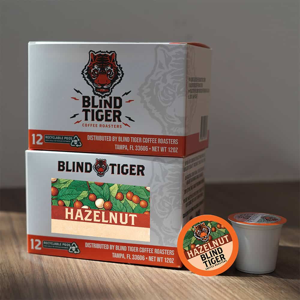 Blind Tiger Coffee Roasters hazelnut coffee packaging on a wooden surface with a neutral background