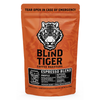 Orange package of Blind Tiger Coffee Roasters Espresso Blend with a tiger logo.