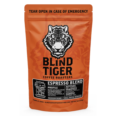 Orange package of Blind Tiger Coffee Roasters Espresso Blend with a tiger logo.