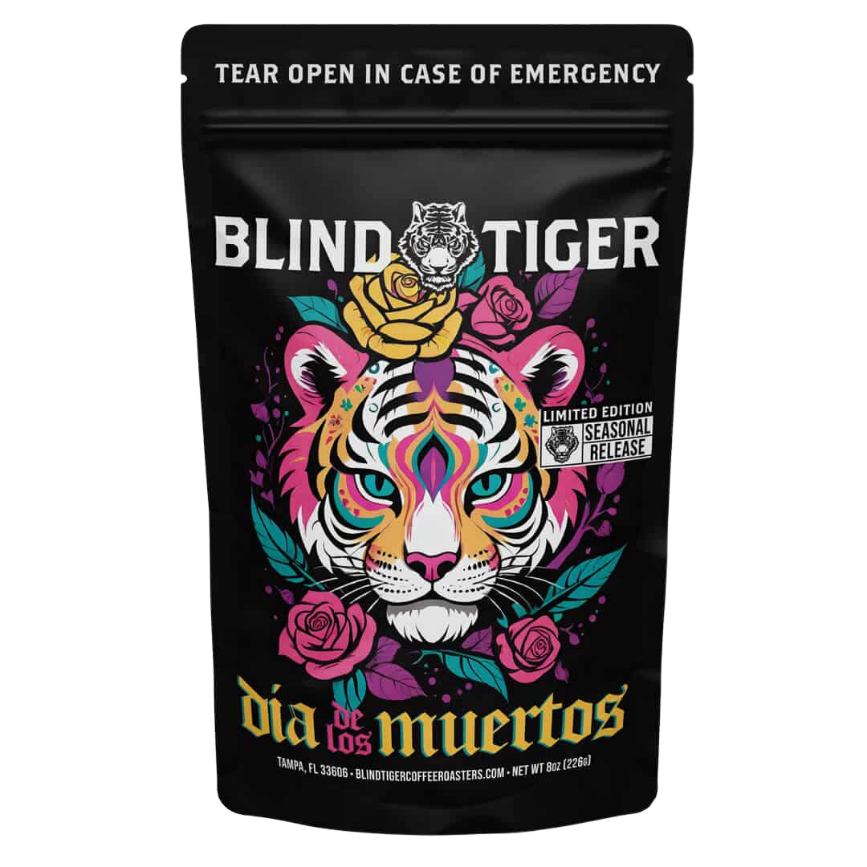 Black coffee bag with colorful tiger design and 'Blind Tiger' branding on a white background