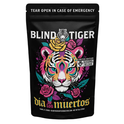 Black coffee bag with colorful tiger design and 'Blind Tiger' branding on a white background