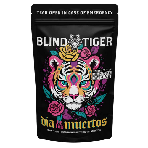 Black coffee bag with colorful tiger design and 'Blind Tiger' branding on a white background