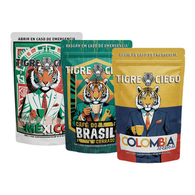 Three Tigre Ciego coffee packages from Mexico, Brazil, and Colombia on a white background